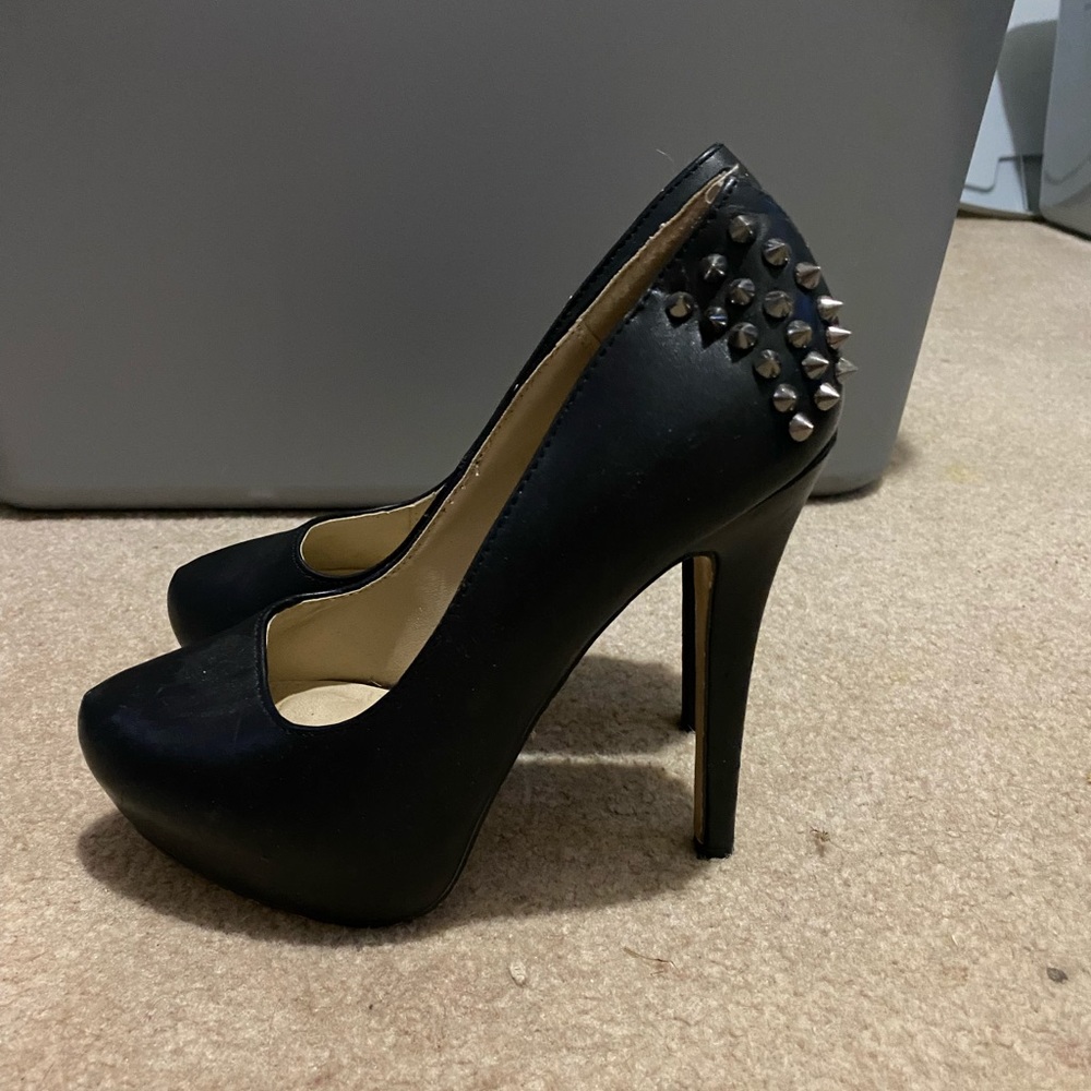 Black heel with metal spike details